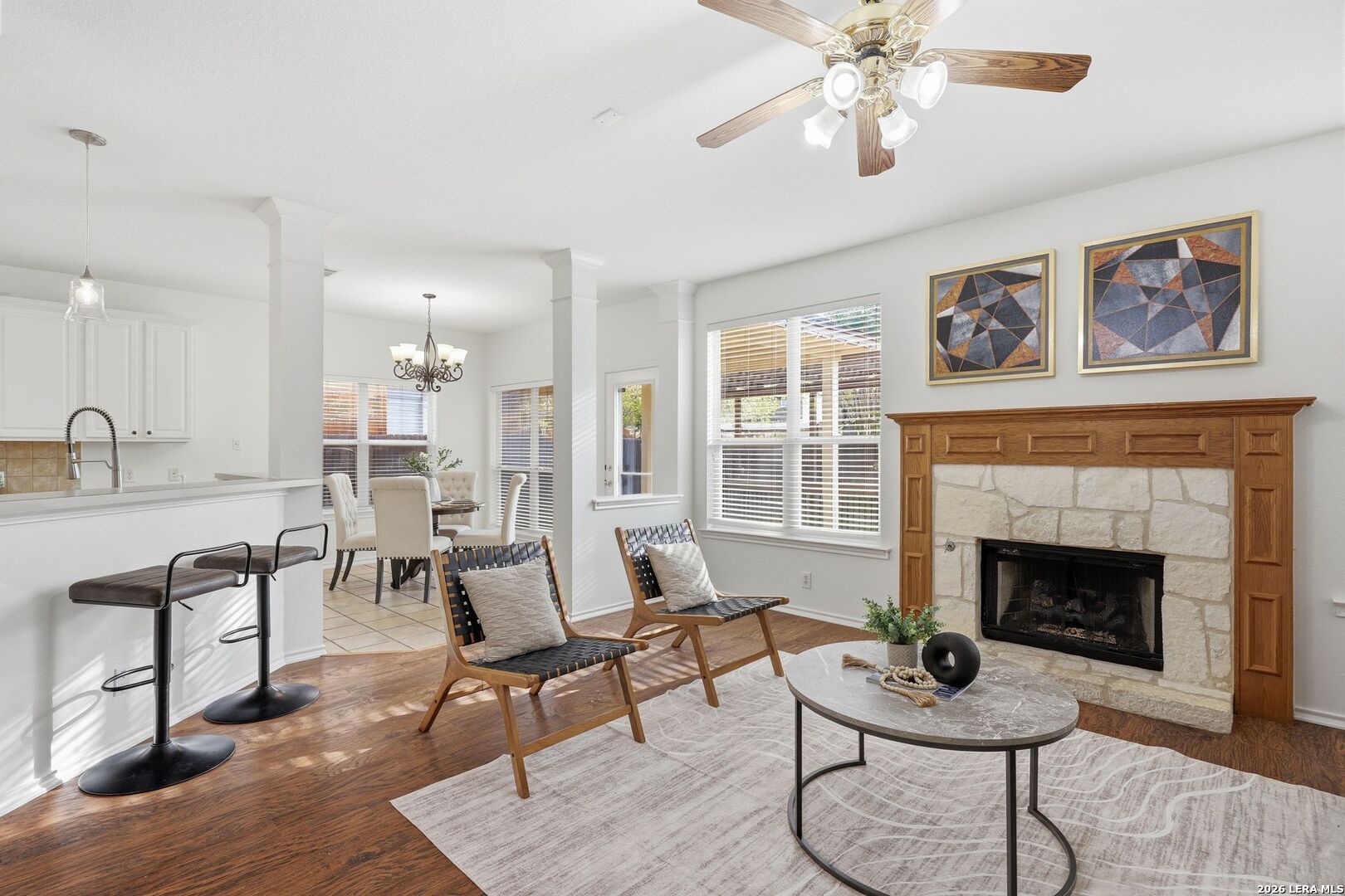 12910 Green Cedar Helotes, TX 78023 - Photo 20 of 65 a living room with furniture a dining table and a fireplace