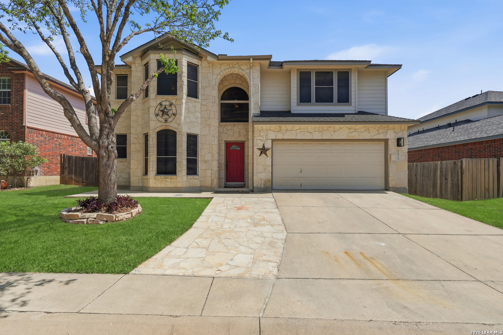 12910 Green Cedar Helotes, TX 78023 - Photo 2 of 65 a front view of a house with garden