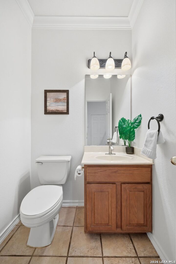 12910 Green Cedar Helotes, TX 78023 - Photo 21 of 65 a bathroom with a toilet sink and mirror