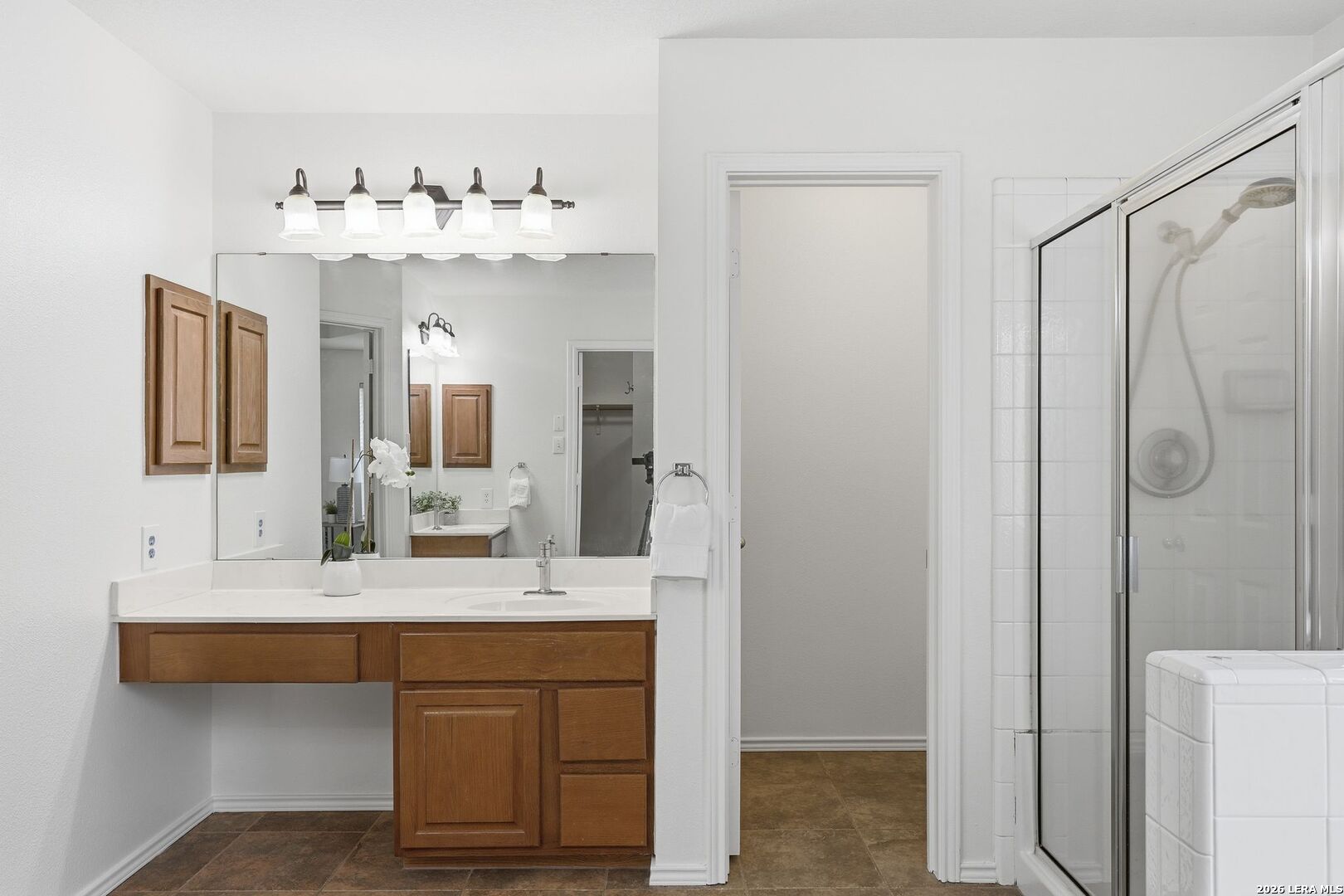 12910 Green Cedar Helotes, TX 78023 - Photo 32 of 65 a bathroom with a double vanity sink mirror and shower