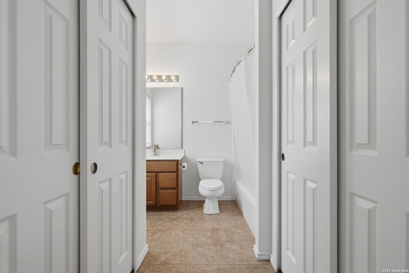 12910 Green Cedar Helotes, TX 78023 - Photo 38 of 65 a bathroom with a granite countertop sink a toilet and shower
