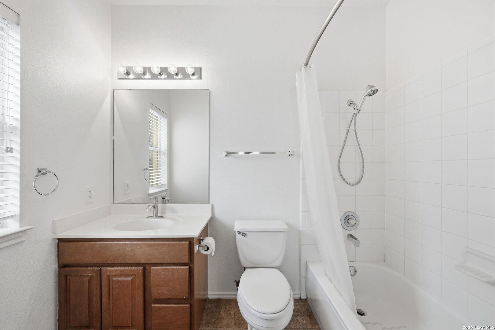 12910 Green Cedar Helotes, TX 78023 - Photo 39 of 65 a bathroom with a toilet sink shower and mirror