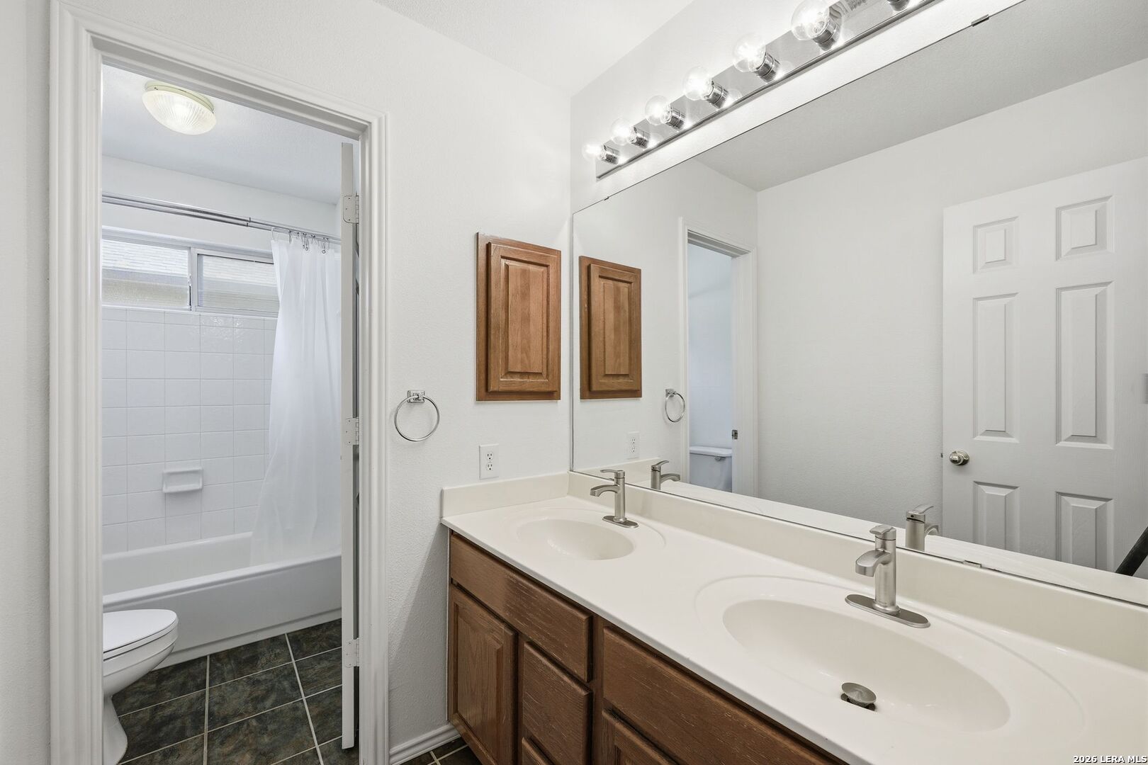 12910 Green Cedar Helotes, TX 78023 - Photo 47 of 65 a bathroom with a sink and a mirror