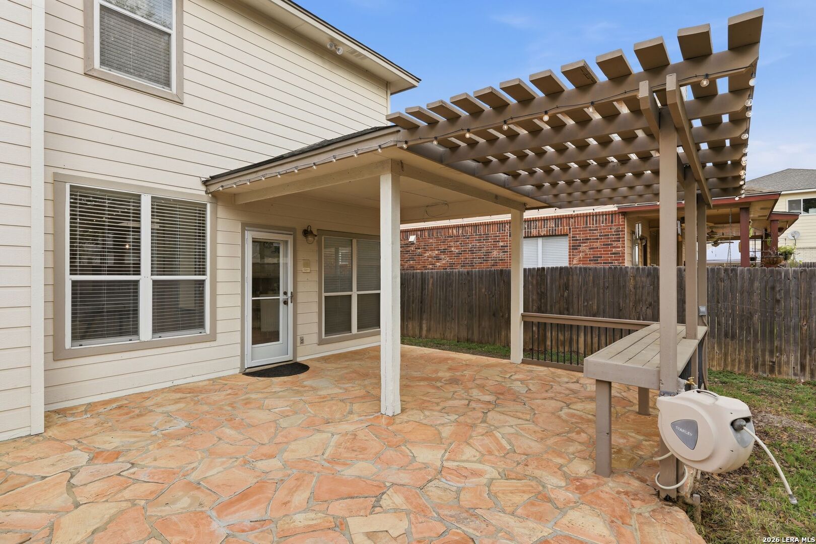 12910 Green Cedar Helotes, TX 78023 - Photo 51 of 65 a view of a porch with a table and chairs and wooden fence