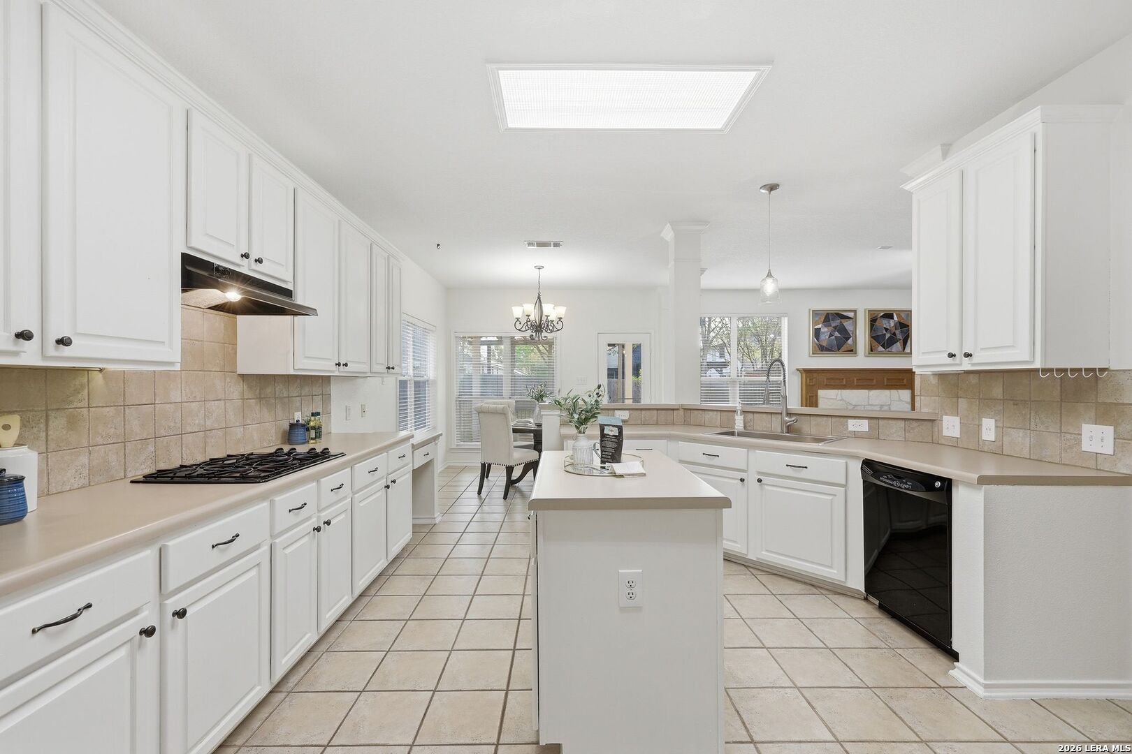 12910 Green Cedar Helotes, TX 78023 - Photo 8 of 65 a kitchen with white cabinets appliances and a sink