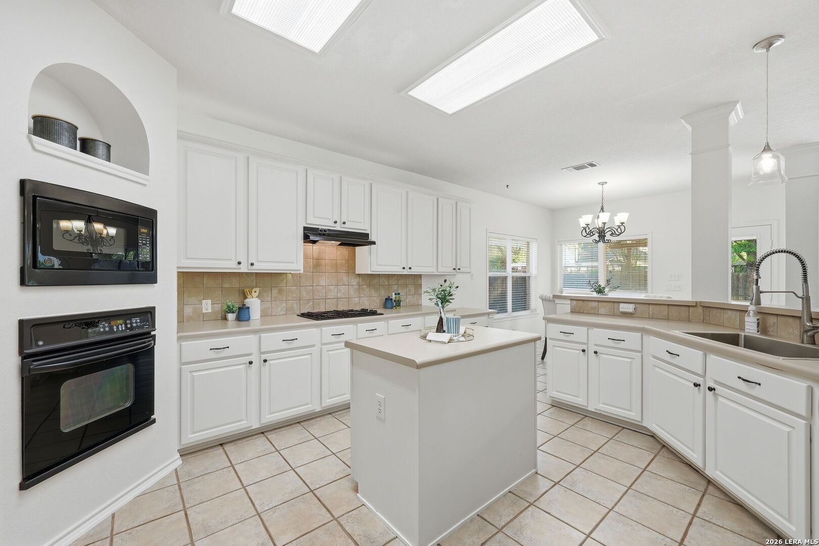 12910 Green Cedar Helotes, TX 78023 - Photo 10 of 65 a kitchen with a sink stove and microwave