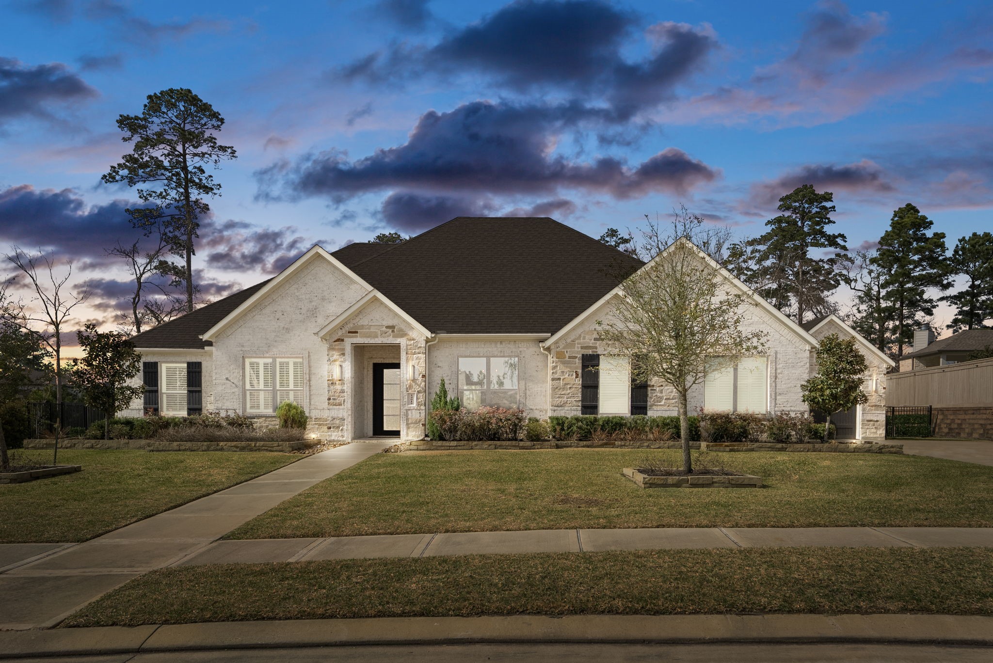a front view of house with yard and green space