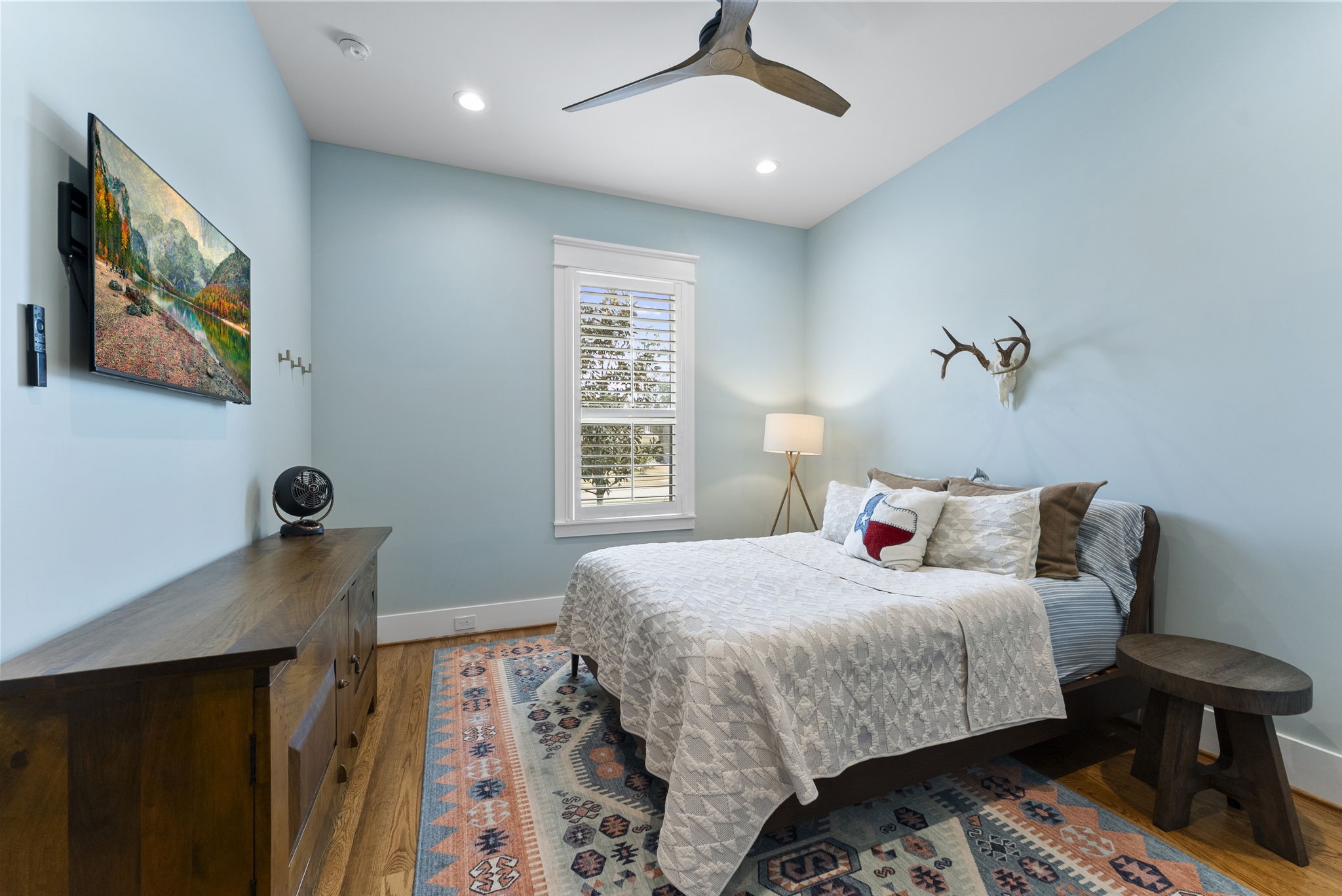 14019 Beartooth Bend Trail Conroe, TX 77384 - Photo 17 of 28 a bedroom with a bed and a window