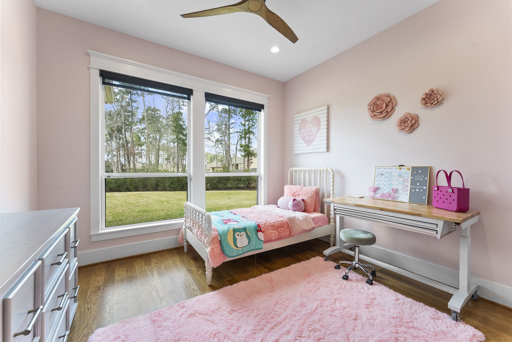 14019 Beartooth Bend Trail Conroe, TX 77384 - Photo 20 of 28 a bedroom with a bed and a window