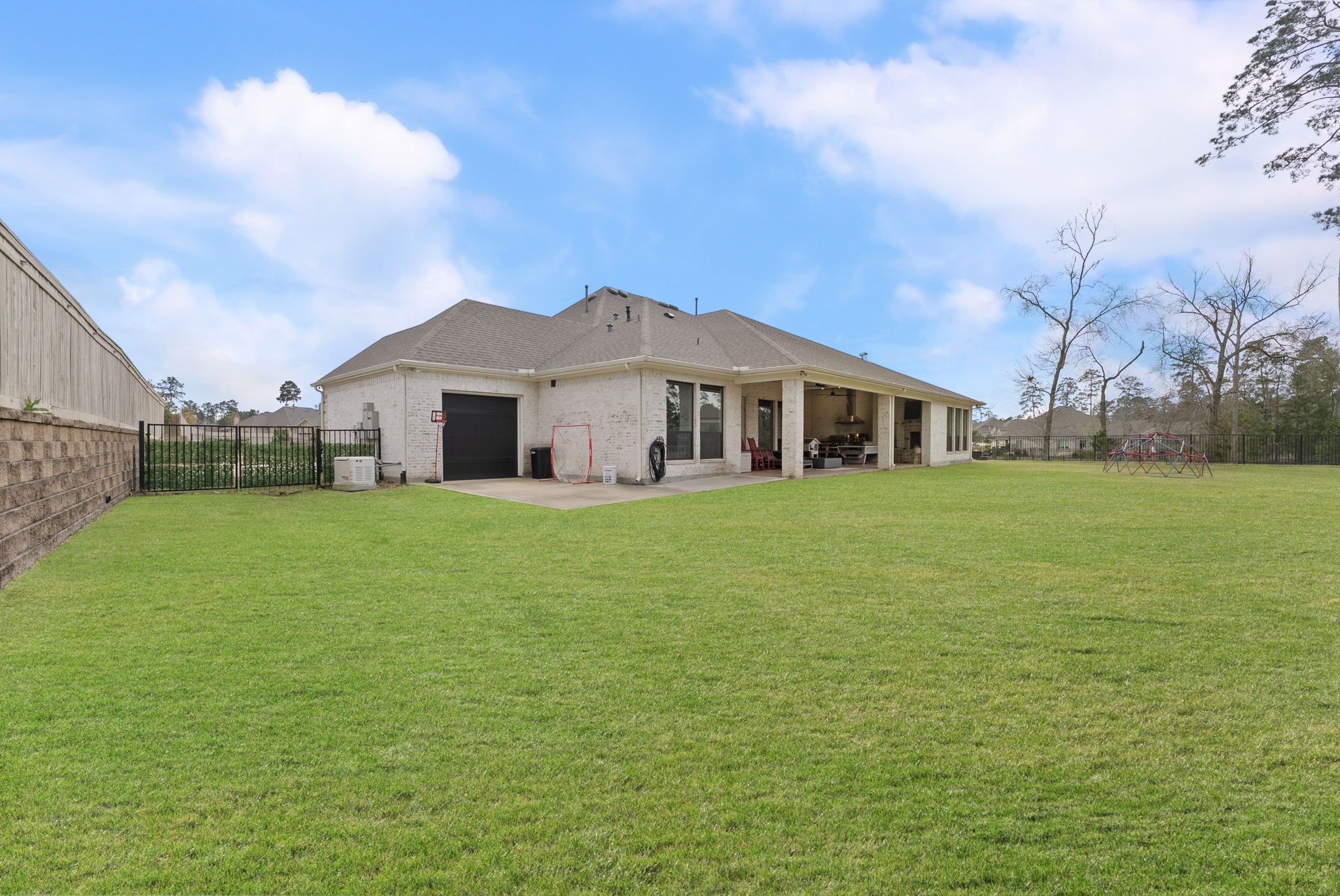 14019 Beartooth Bend Trail Conroe, TX 77384 - Photo 24 of 28 a view of a house with a yard