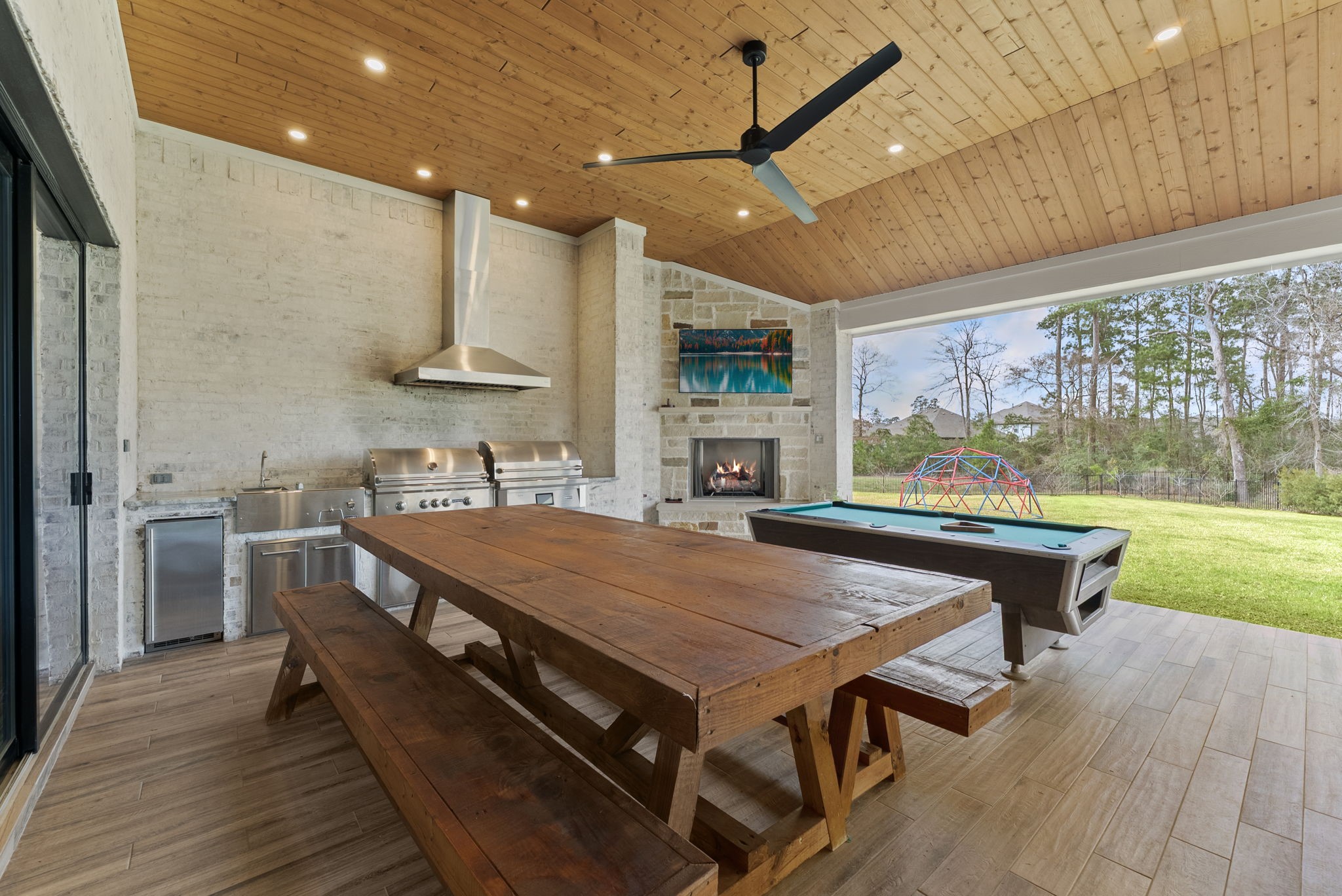 14019 Beartooth Bend Trail Conroe, TX 77384 - Photo 26 of 28 a room with stainless steel appliances a table chairs and a kitchen view