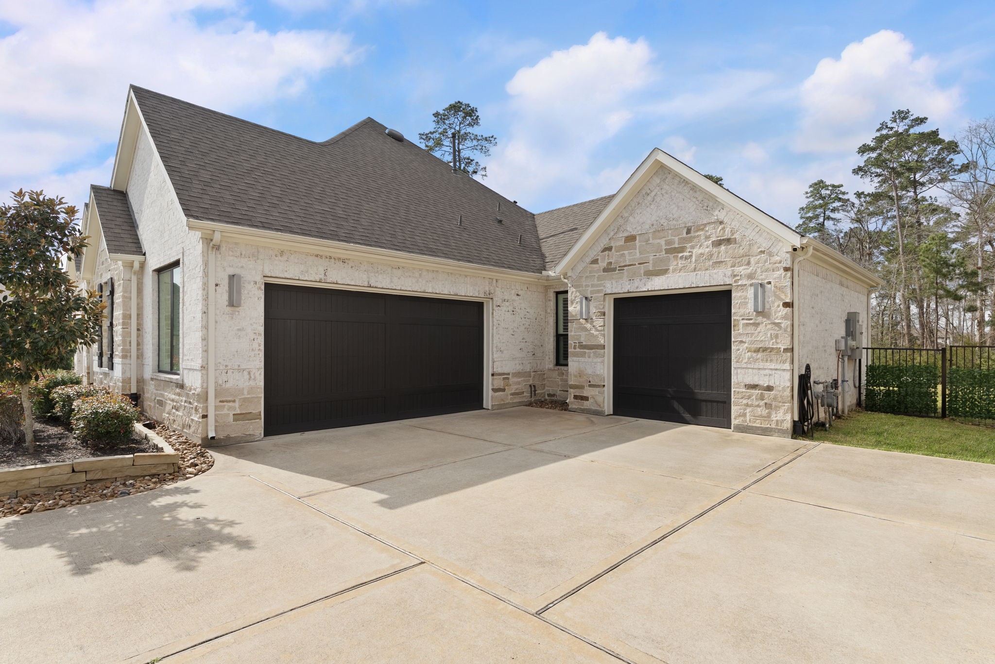 14019 Beartooth Bend Trail Conroe, TX 77384 - Photo 3 of 28 a front view of a house with a yard and garage