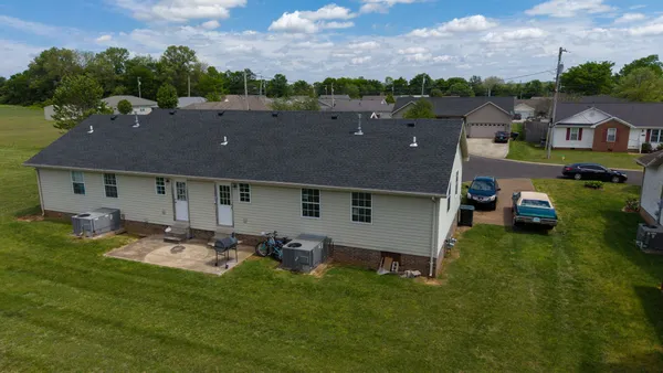 an aerial view of a house with a garden view