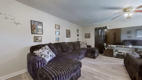 a kitchen with stainless steel appliances granite countertop a refrigerator stove top oven and sink