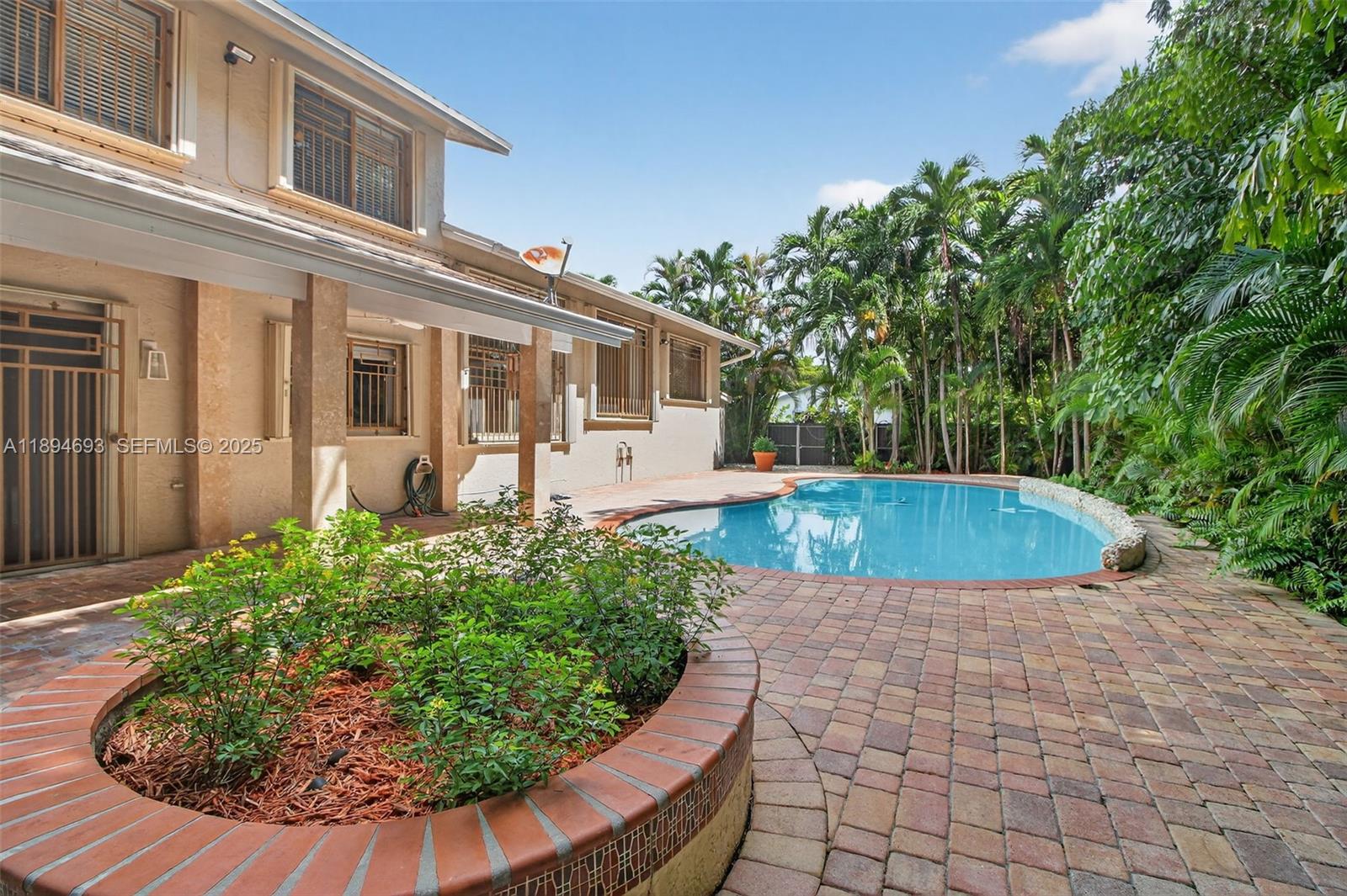 13830 Southwest 108th Street Miami, FL 33186 - Photo 11 of 40 a view of a house with a yard