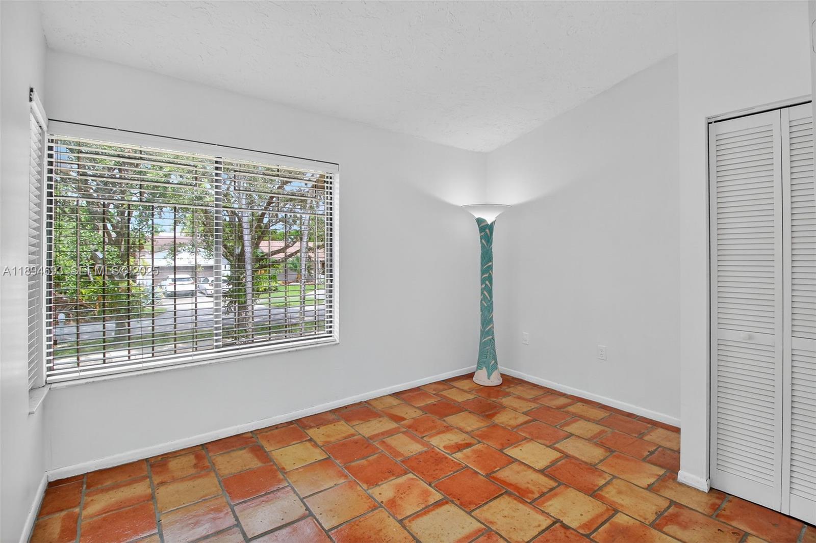 13830 Southwest 108th Street Miami, FL 33186 - Photo 21 of 40 a view of an empty room with a window