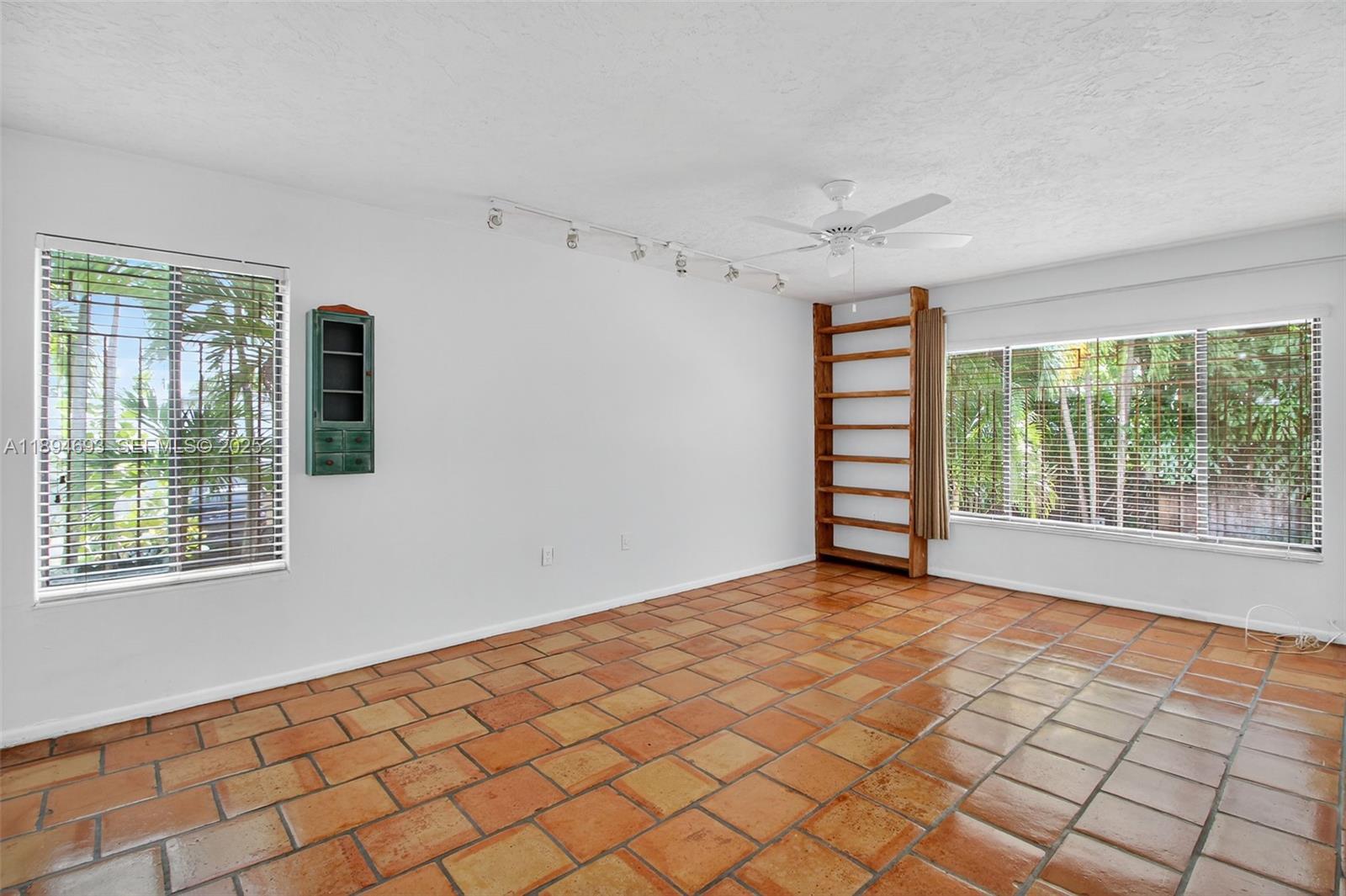 13830 Southwest 108th Street Miami, FL 33186 - Photo 22 of 40 a view of an empty room with a window