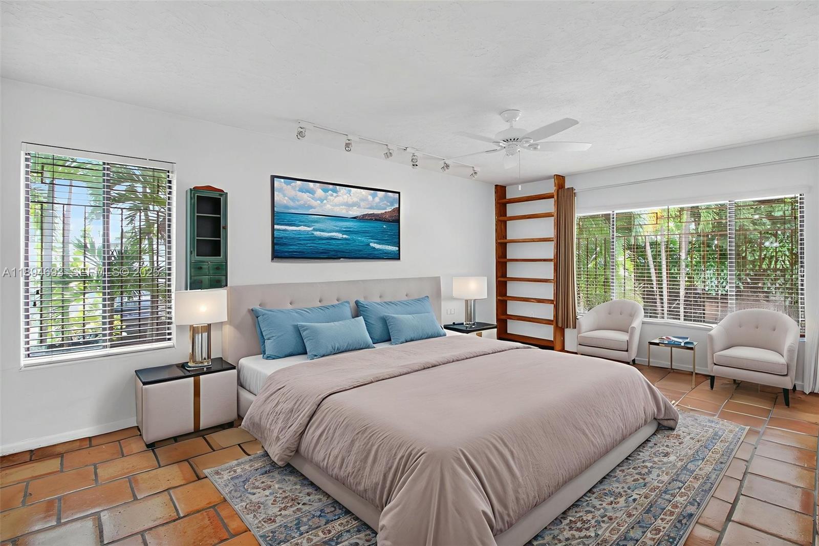 13830 Southwest 108th Street Miami, FL 33186 - Photo 23 of 40 a bedroom with a large bed and a couch