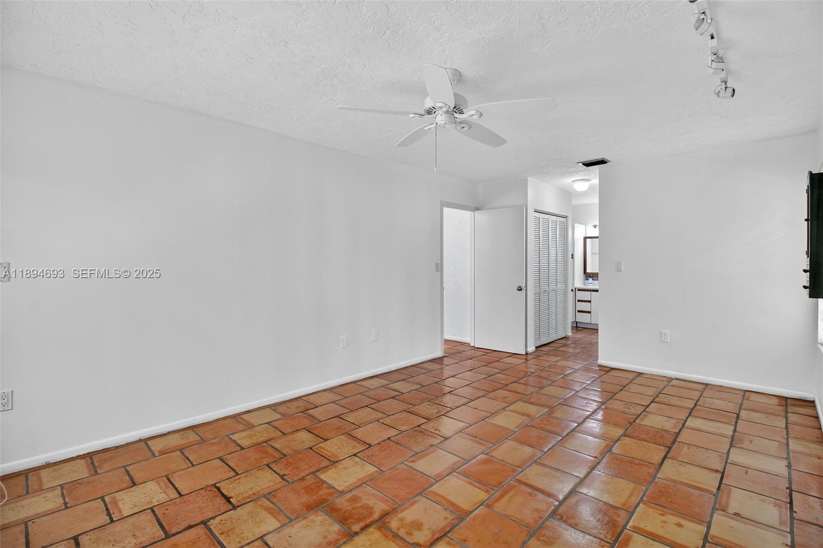 13830 Southwest 108th Street Miami, FL 33186 - Photo 24 of 40 a view of an empty room