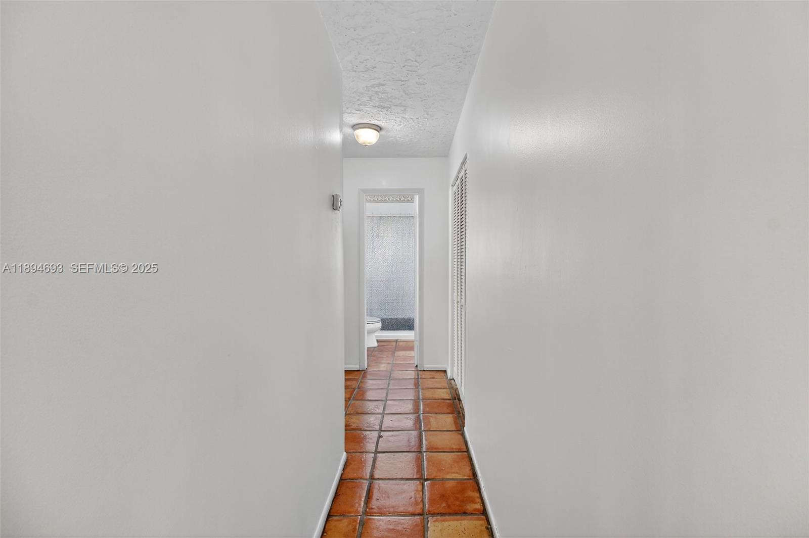 13830 Southwest 108th Street Miami, FL 33186 - Photo 25 of 40 a view of a hallway with wooden floor and staircase