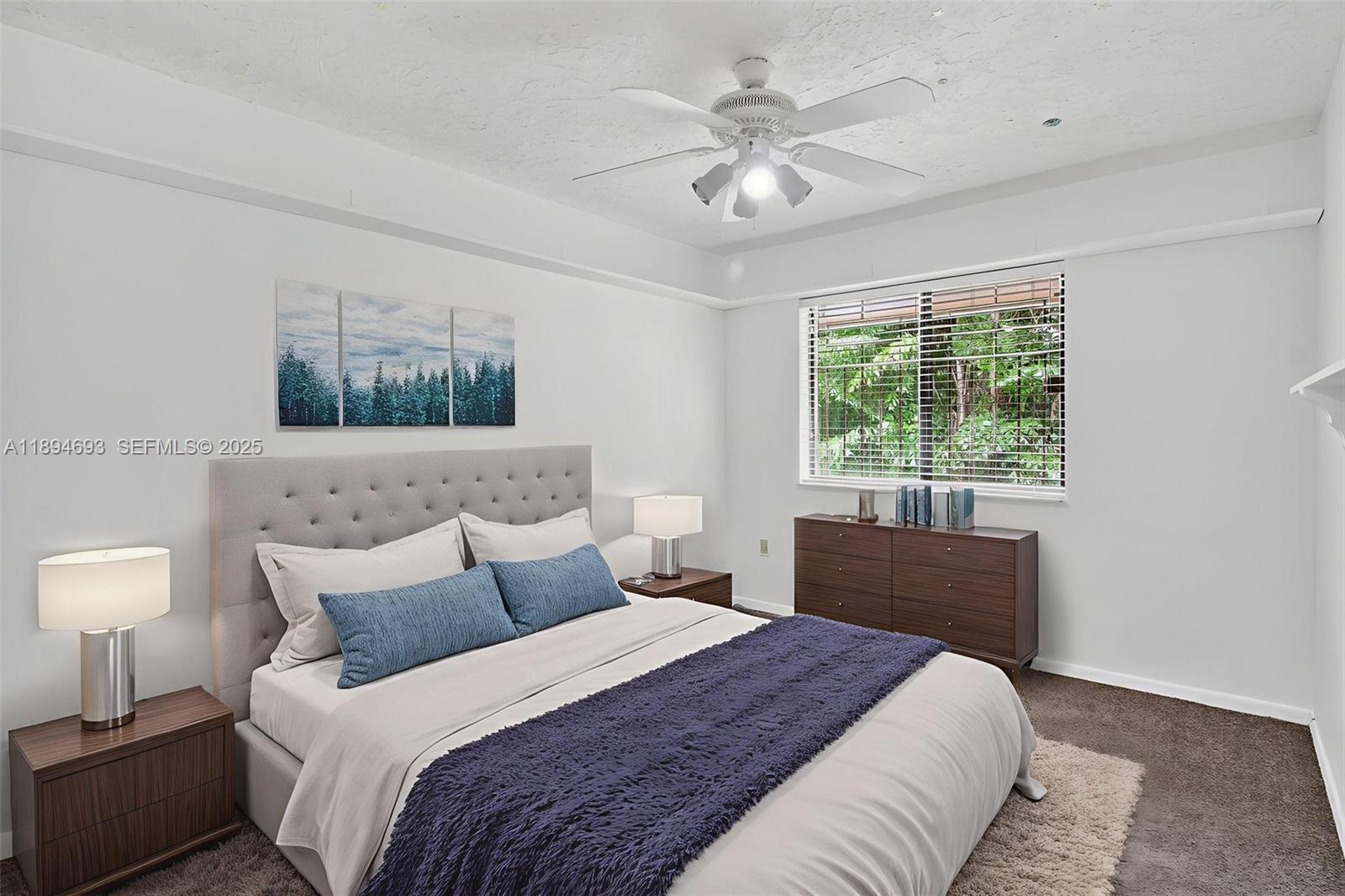 13830 Southwest 108th Street Miami, FL 33186 - Photo 27 of 40 a bedroom with a large bed and a window