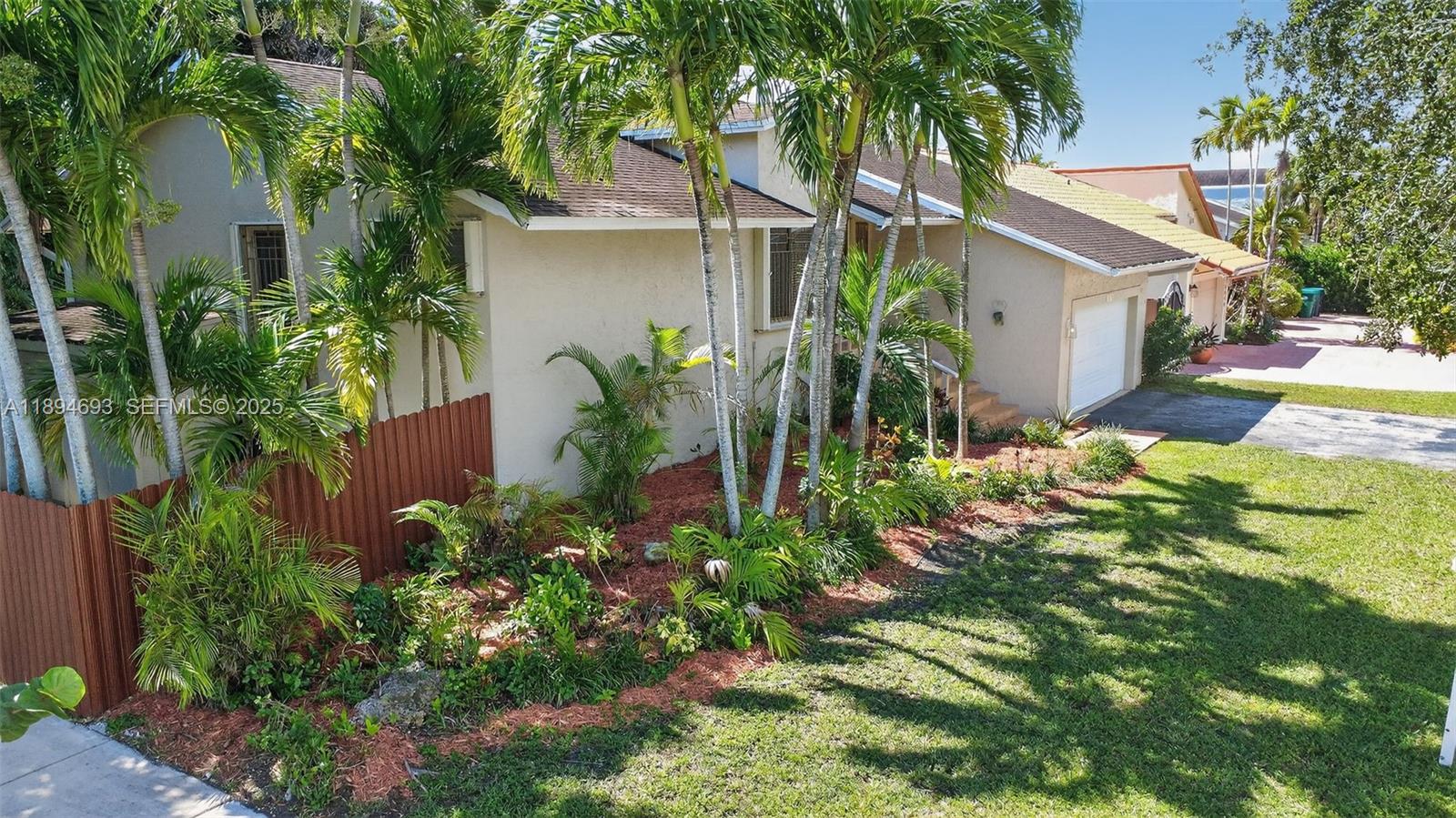 13830 Southwest 108th Street Miami, FL 33186 - Photo 3 of 40 front view of a house with a yard