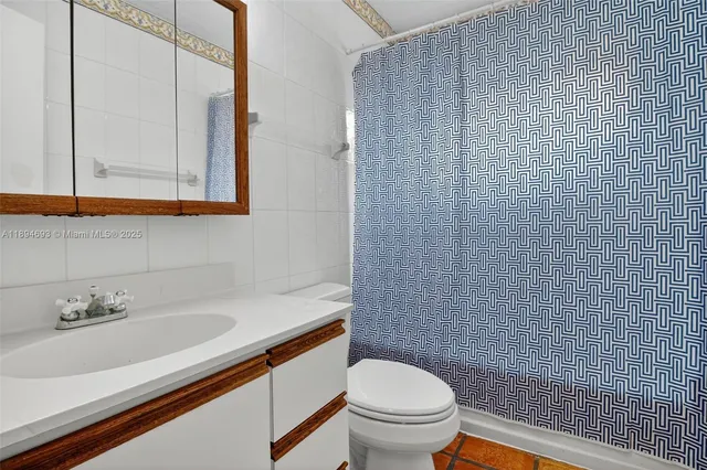 a bathroom with a window sink and vanity