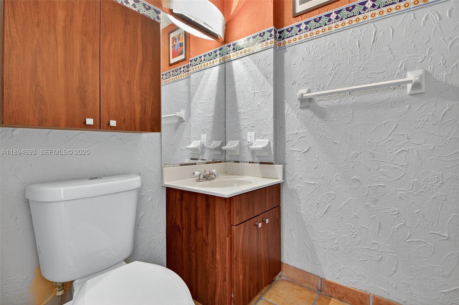 13830 Southwest 108th Street Miami, FL 33186 - Photo 35 of 40 a bathroom with a sink a toilet and shower