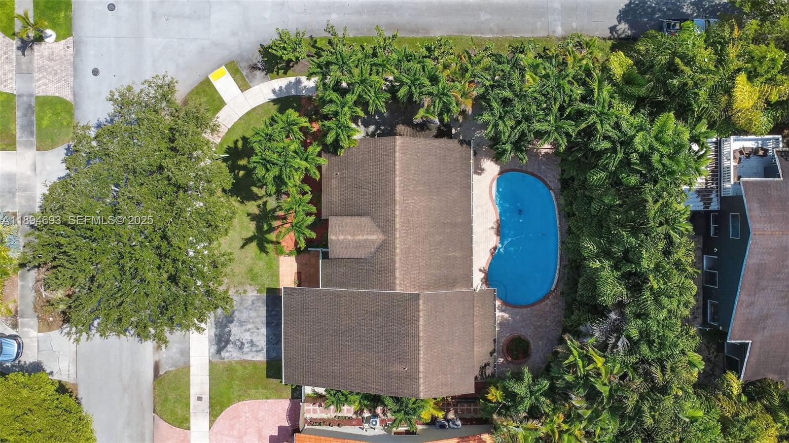 13830 Southwest 108th Street Miami, FL 33186 - Photo 5 of 40 an aerial view of a house with a yard and garden