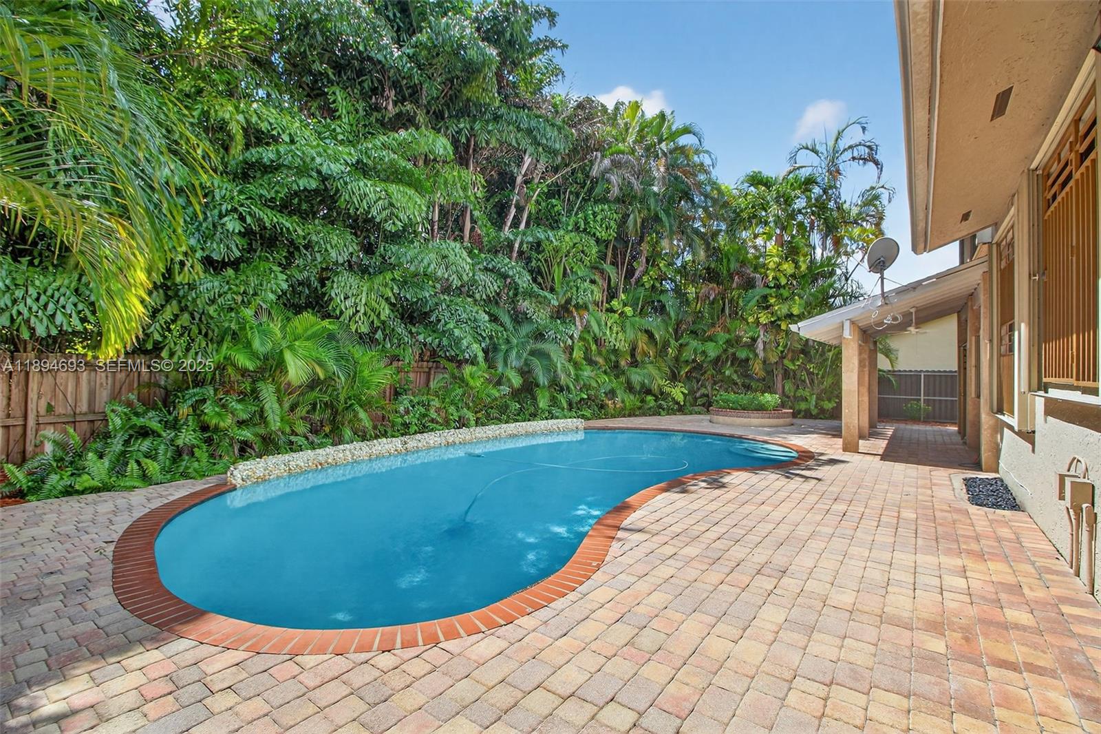 13830 Southwest 108th Street Miami, FL 33186 - Photo 9 of 40 a view of a swimming pool with an outdoor space