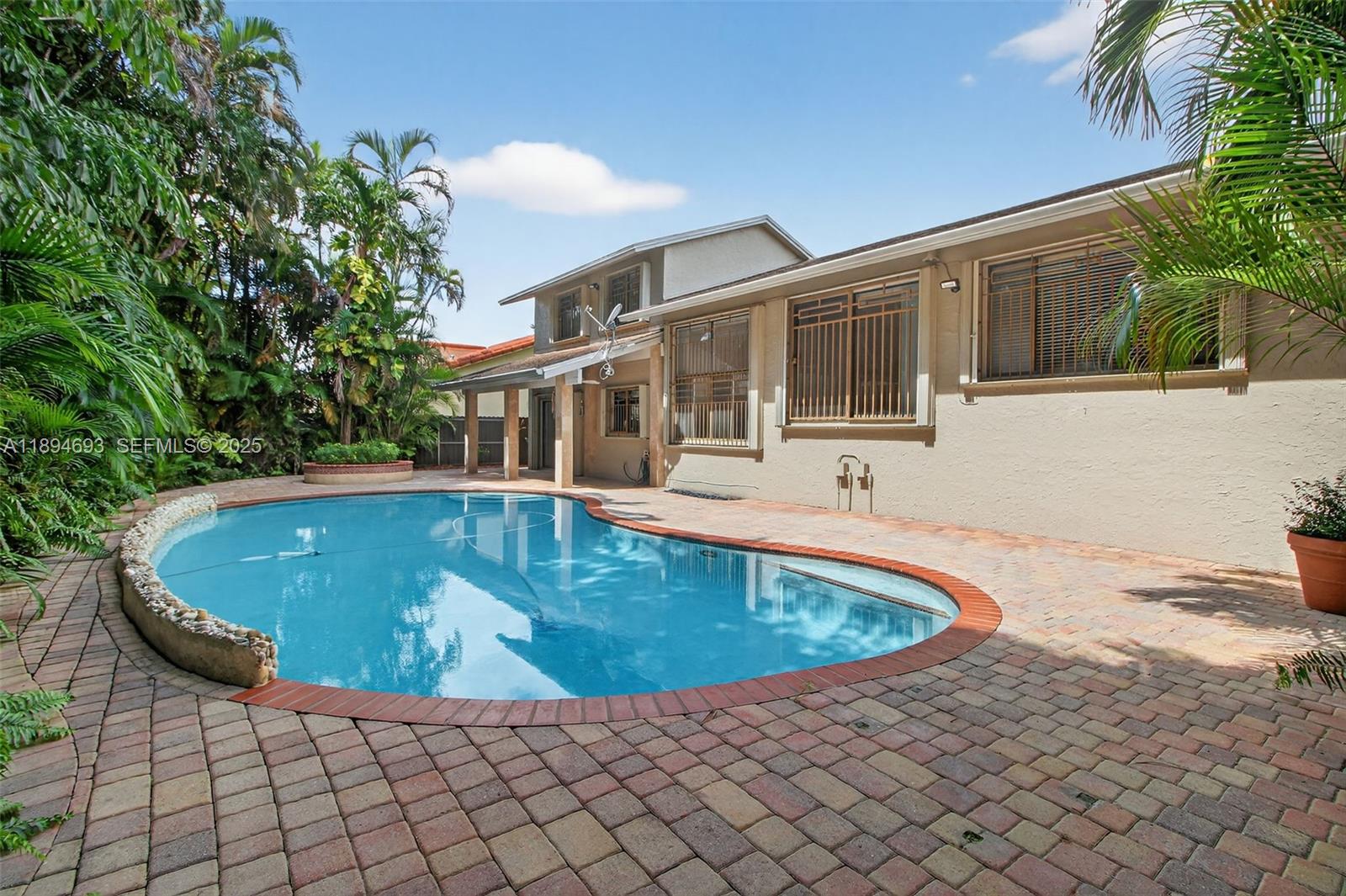 13830 Southwest 108th Street Miami, FL 33186 - Photo 10 of 40 a view of outdoor space yard swimming pool and sitting area