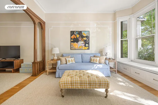 a spacious bedroom with a bed and a couch