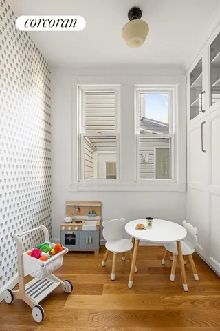 a bedroom with furniture and a window