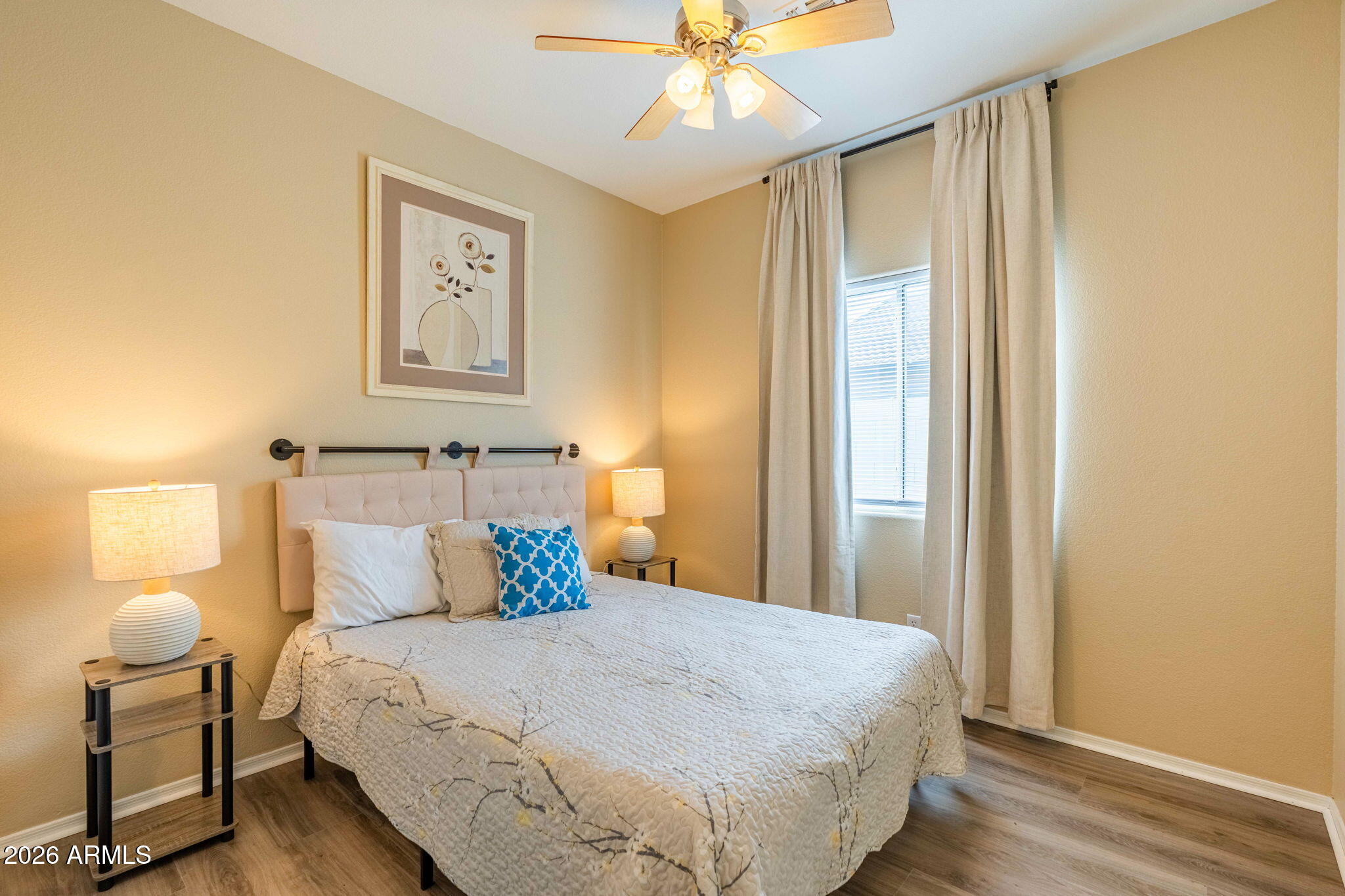 3674 South Joshua Tree Lane Gilbert, AZ 85297 - Photo 21 of 30 a bedroom with a bed and wooden floor