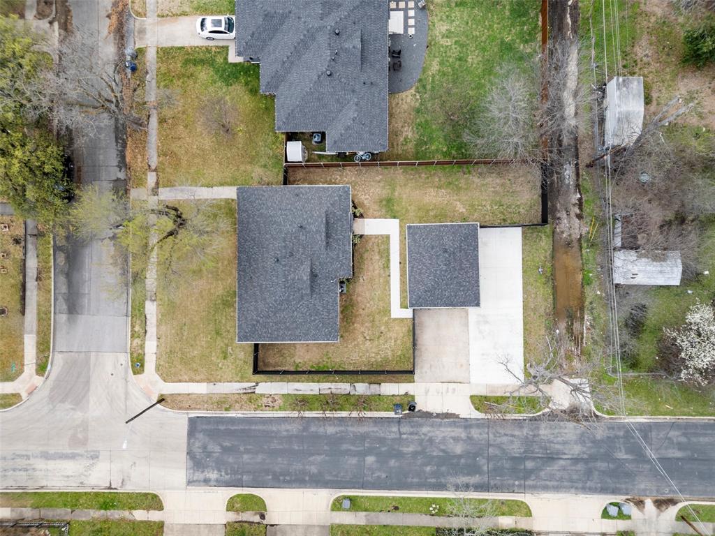 2945 Healey Drive Dallas, TX 75228 - Photo 36 of 38 an aerial view of a house with a yard