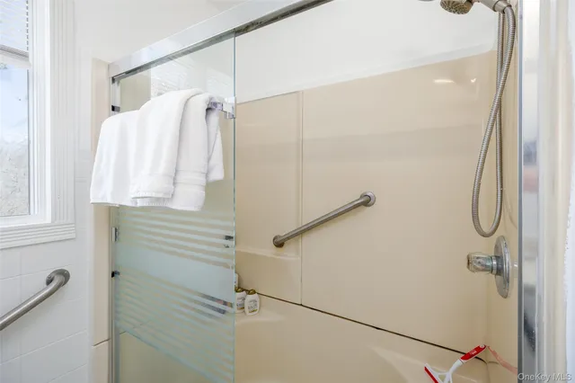 a bathroom with a shower and a shower curtain