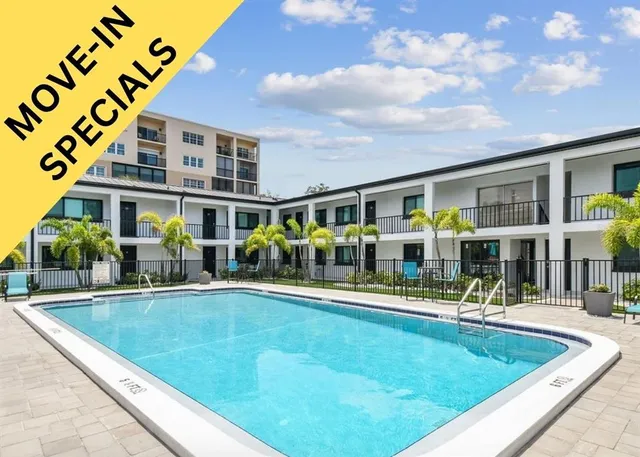 swimming pool view with outdoor seating