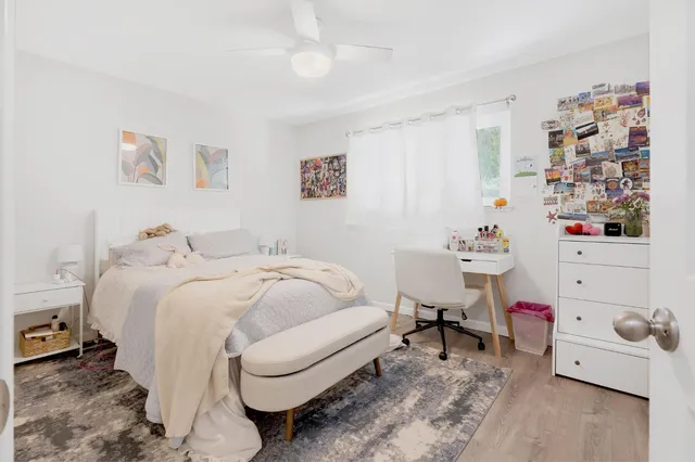 a bed room with a bed and a window