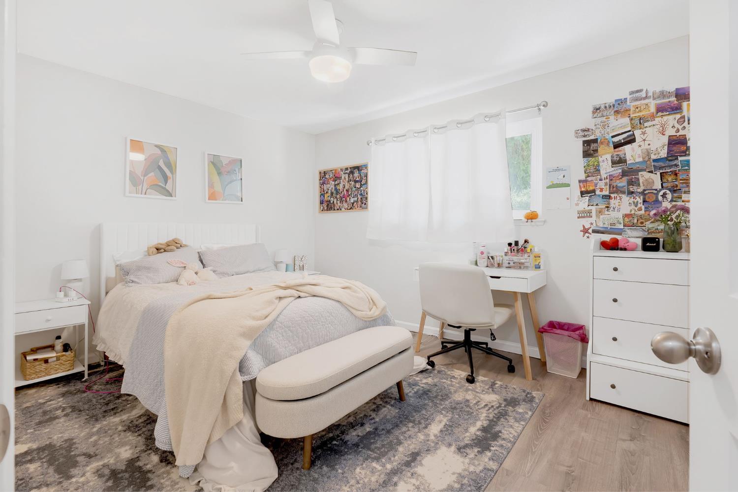 217 La Vida Way Davis, CA 95618 - Photo 14 of 18 a bed room with a bed and a window