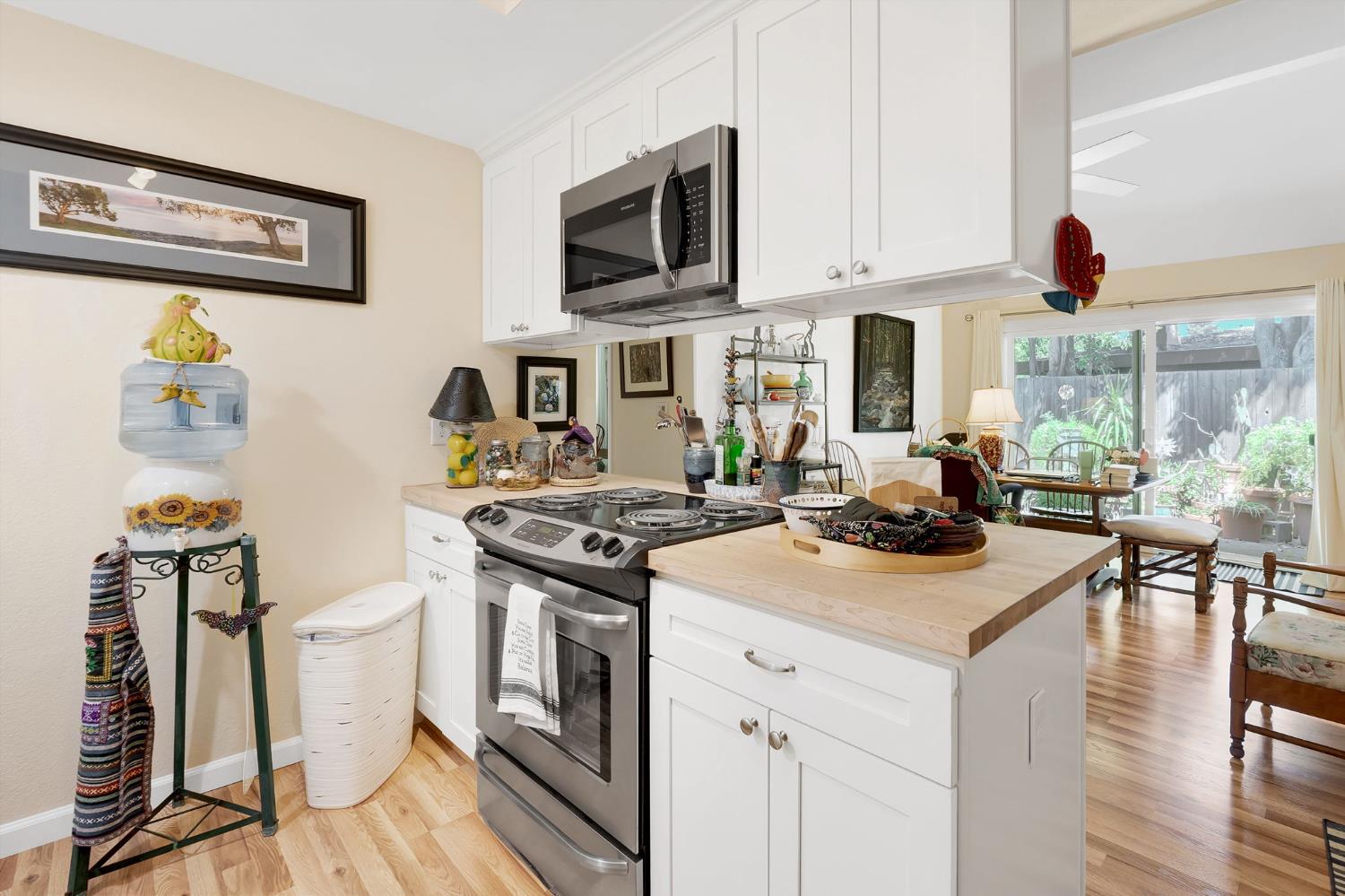 217 La Vida Way Davis, CA 95618 - Photo 4 of 18 a kitchen with a stove a sink and a refrigerator