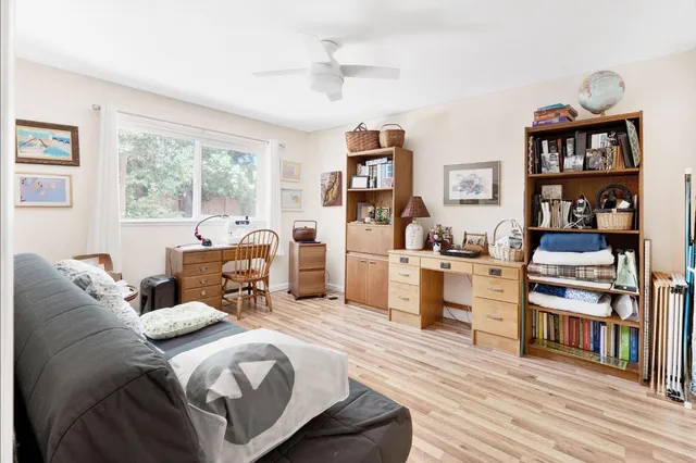 a bed room with bed and a book shelf
