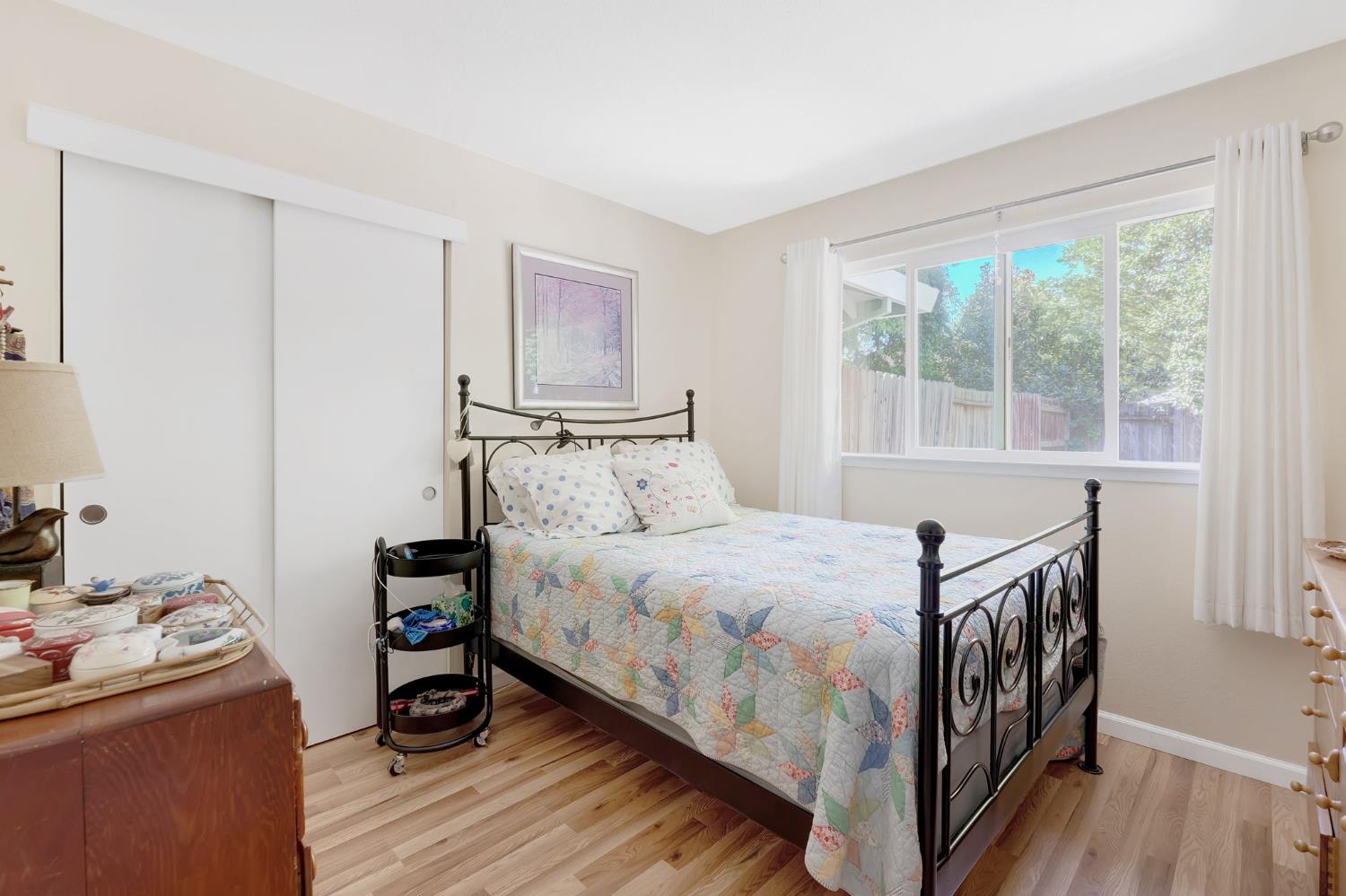 217 La Vida Way Davis, CA 95618 - Photo 7 of 18 a bedroom with a bed and a window