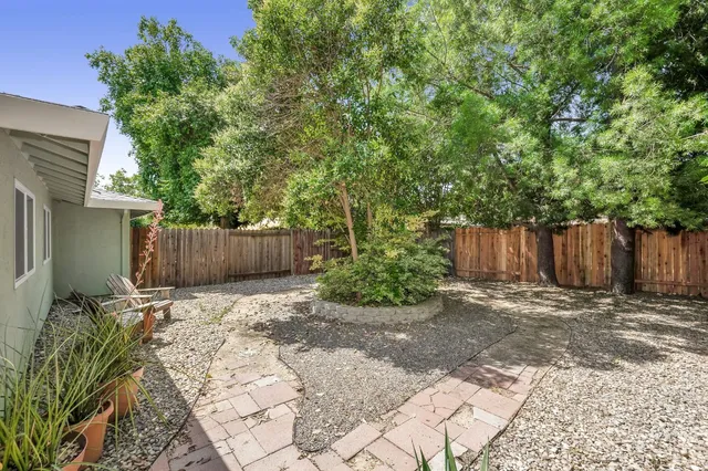 a backyard of a house with lots of green space