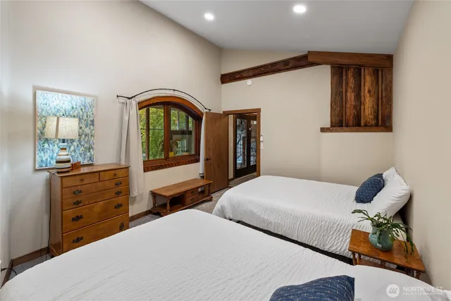 a bedroom with a bed and a dresser