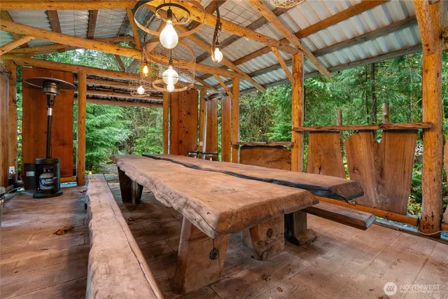 a dinning table and chairs in patio of the house
