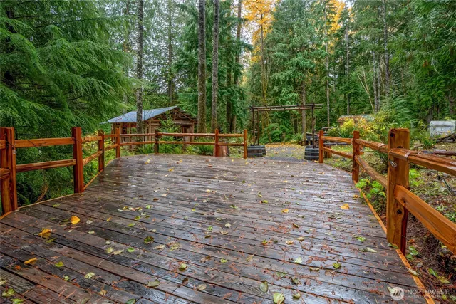 a view of a backyard with sitting area