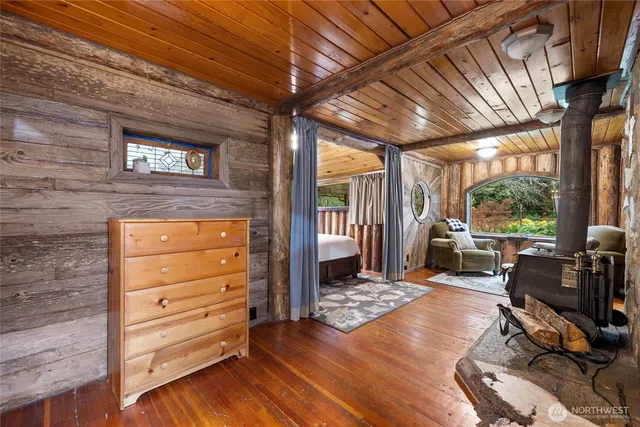 a living room with furniture and large windows