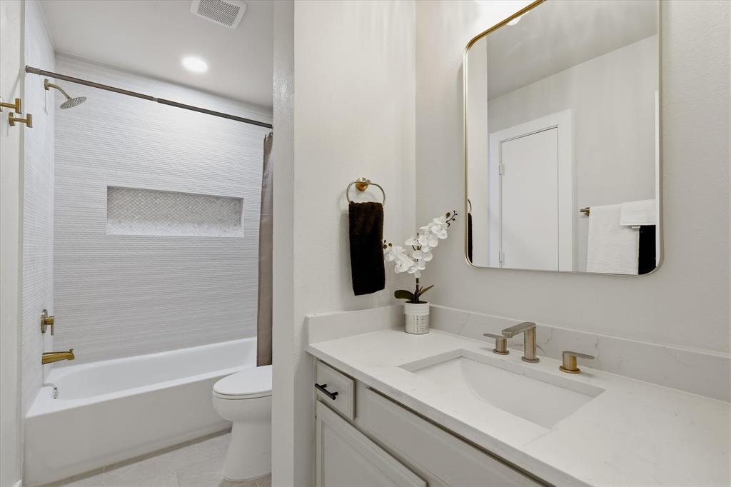 3405 Mill Ridge Street Bedford, TX 76021 - Photo 22 of 32 Modern vanity with an integrated sink and light-toned countertop