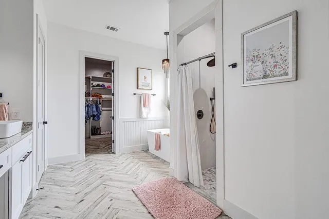 a bathroom with a sink and a shower