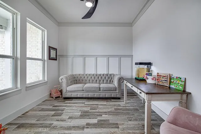 a living room with furniture and a window